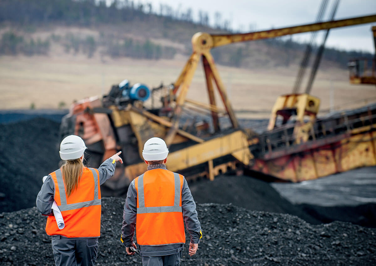 Coal mine workers in an open pit